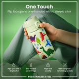 A light-green, dinosaur-decorated water bottle is held; its flip top opens one-handed. The bottle is being shown against a green background. 