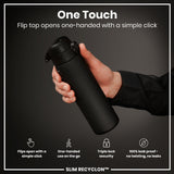 A black water bottle is held; its flip top opens one-handed via a simple click. The background is dark grey. 