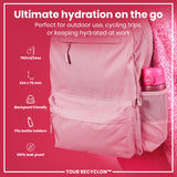 A pink backpack, containing a pink water bottle, rests against a pink sweater. The backpack is advertised as being 