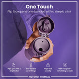 A purple thermos's flip top is opened one-handed; a person demonstrates its features against a purple background. 