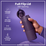 A purple thermal cup with a 240° opening lid is held; its lid folds back, away from the face, facilitating on-the-go drinking. The text on the image is: 