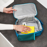 A rectangular teal lunchbox showcases colorful cartoon vehicles including cars, buses, and trucks with road signs such as 