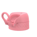 A pink, textured bottle cap features a loop handle for easy carrying. The cap is set against a plain white background and has the text 