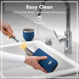 A person cleans a blue travel flask labeled 