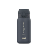 A dark gray water bottle stands upright featuring a flip-top lid and customization text: 