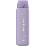 A lavender water bottle stands upright displaying text: 