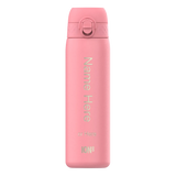 Pink insulated bottle standing upright displaying the text 
